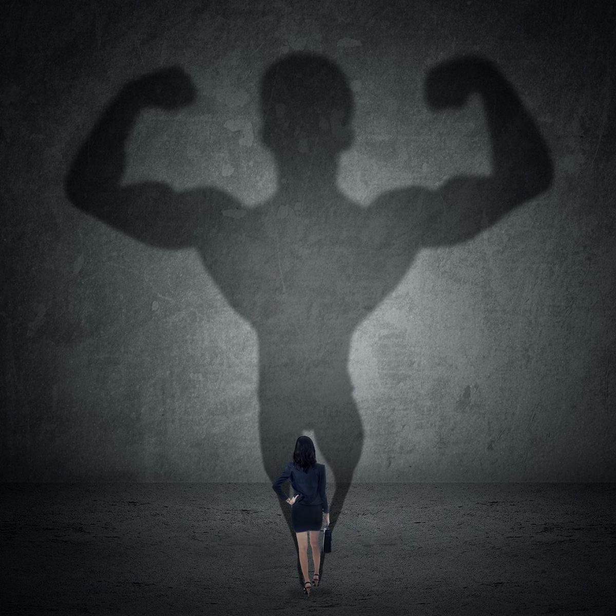 Businesswoman and strong shadow