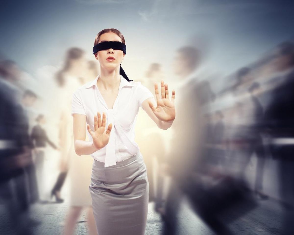 Businesswoman blindfolded