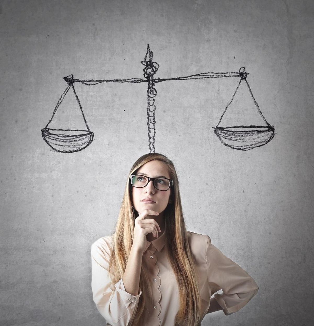 Businesswoman considering how to balance risk with innovation