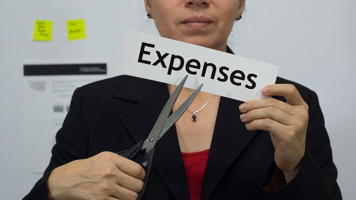Businesswoman Cuts Expenses Concept
