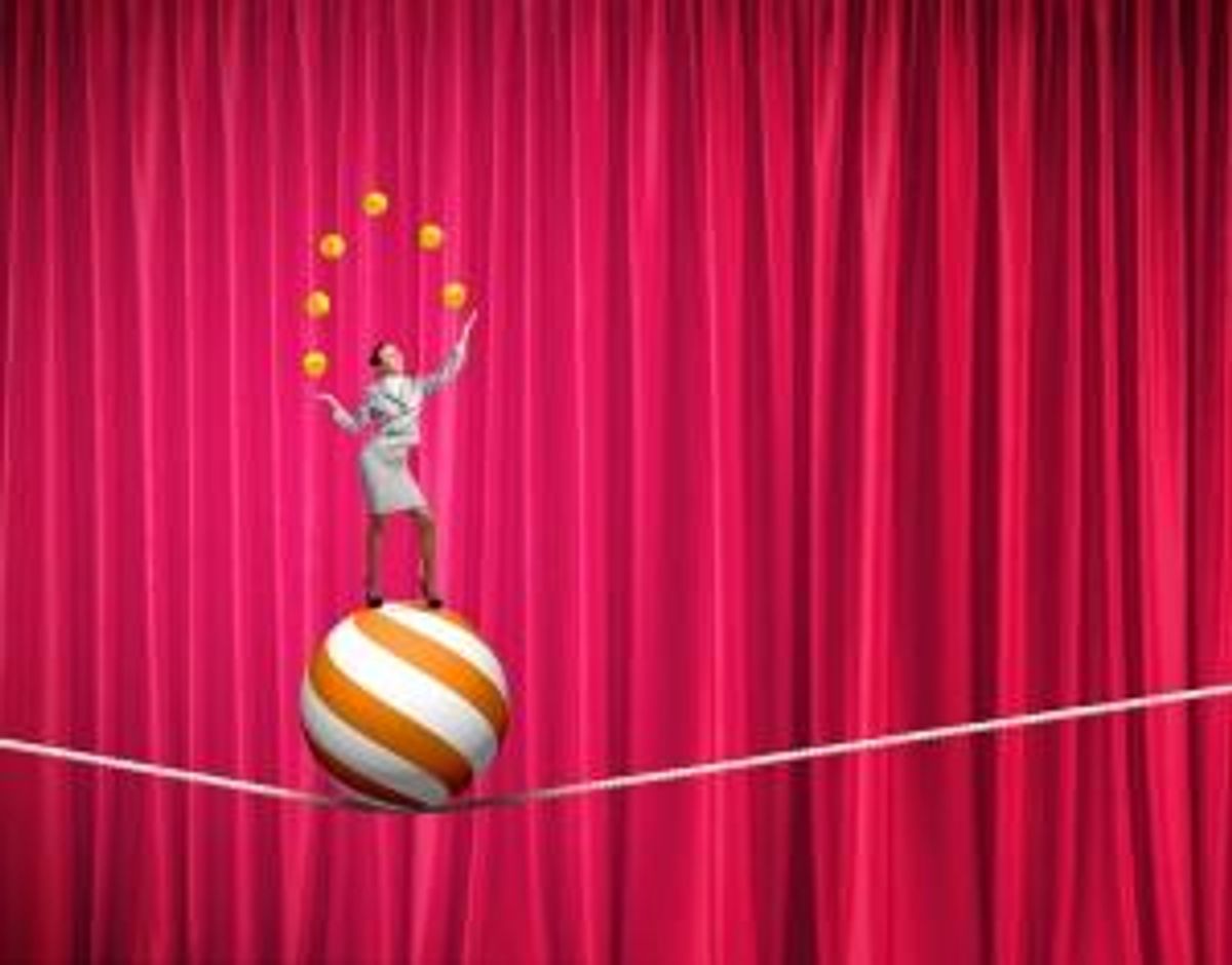 Businesswoman juggling