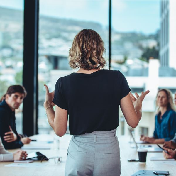 Businesswoman pitching to potential investors