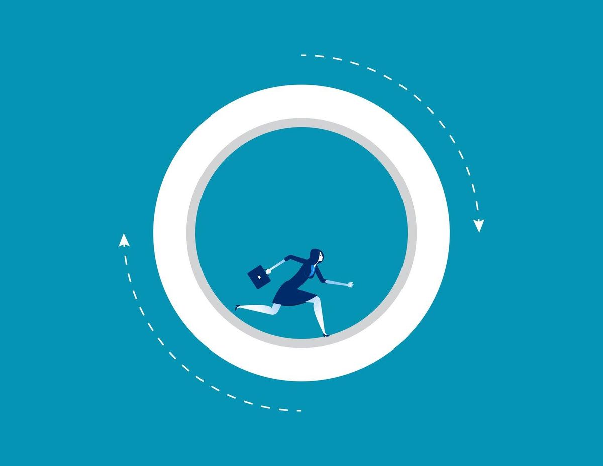 Businesswoman running inside wheel