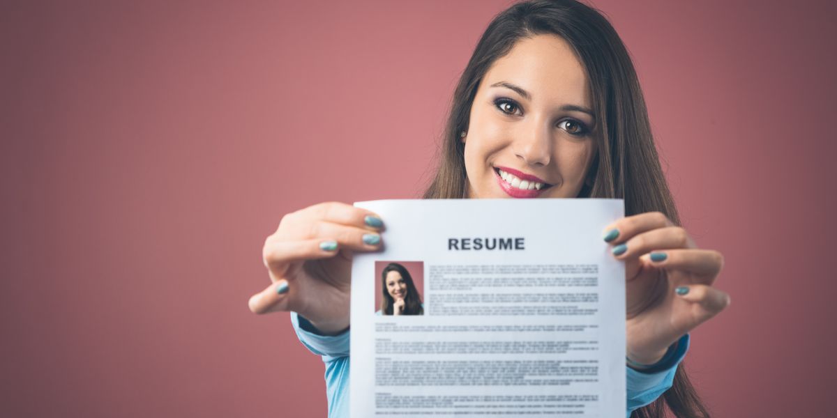 Candidate holding her resume for a social media marketer position