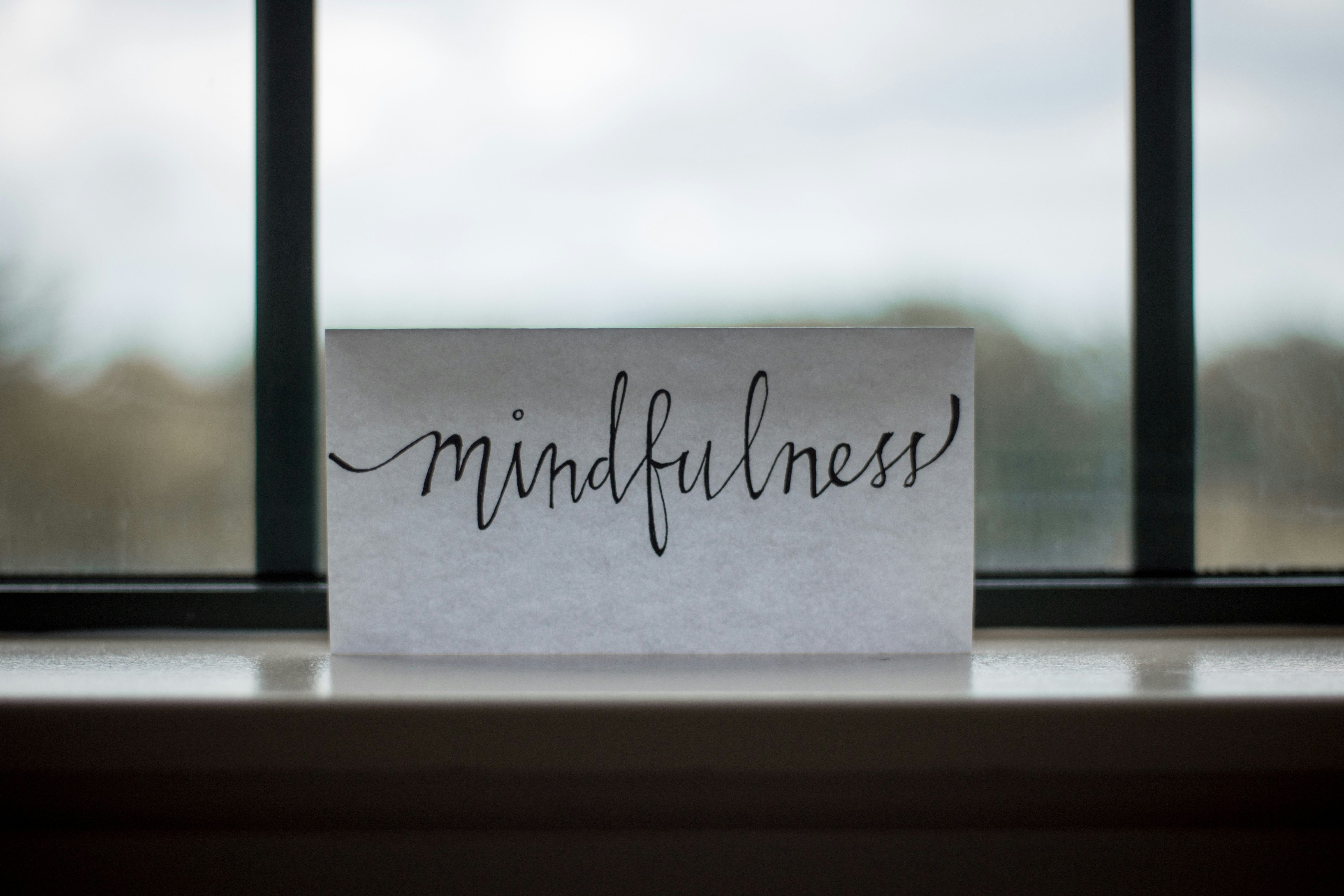Card with the word mindfulness written on it
