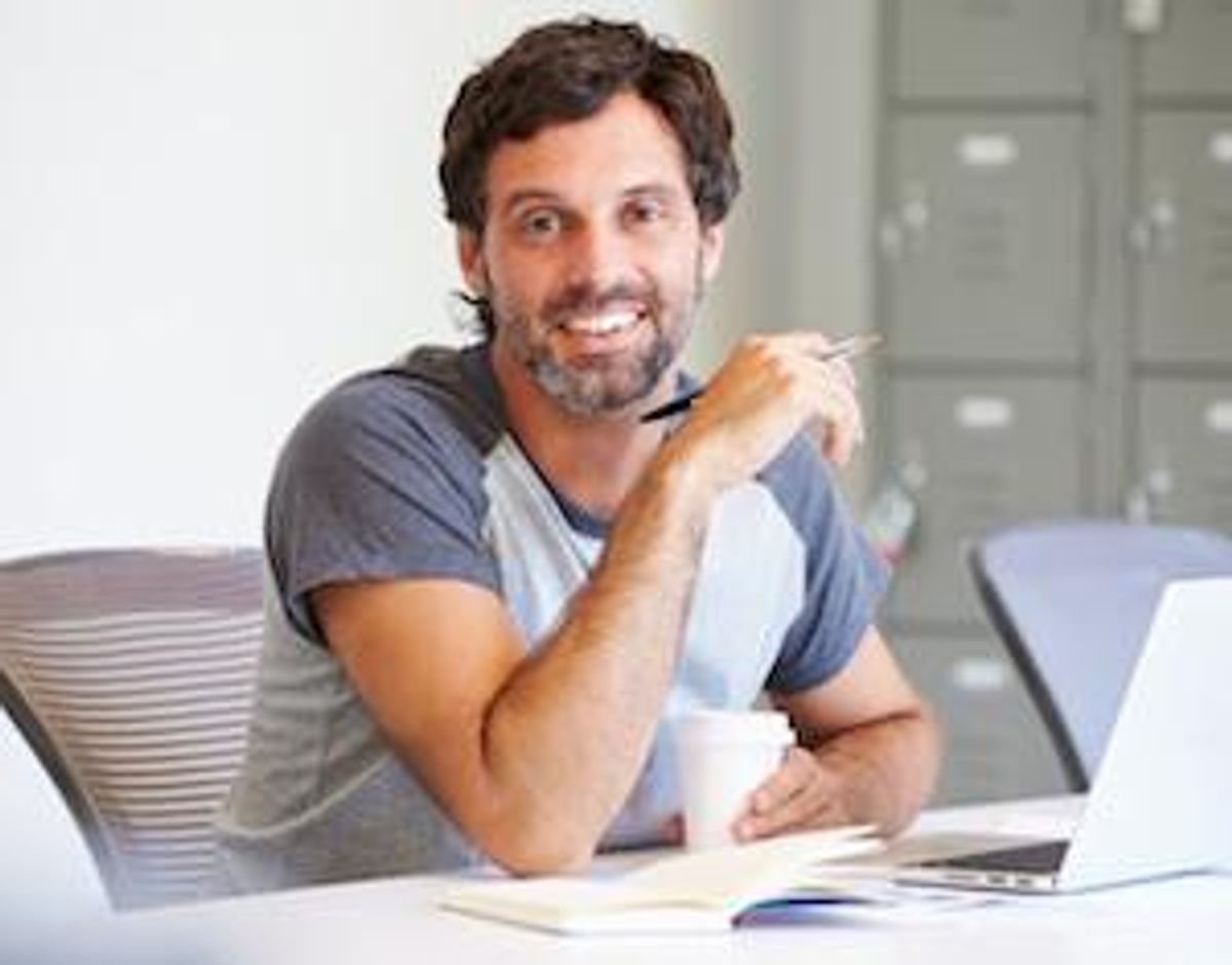 Casually-Dressed-Man-Working-In-Design-Studio