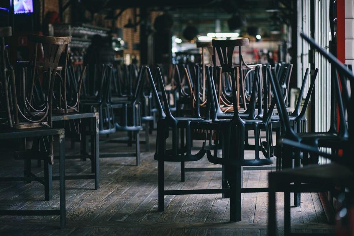 Chairs and tables stacked in a closed restaurant business