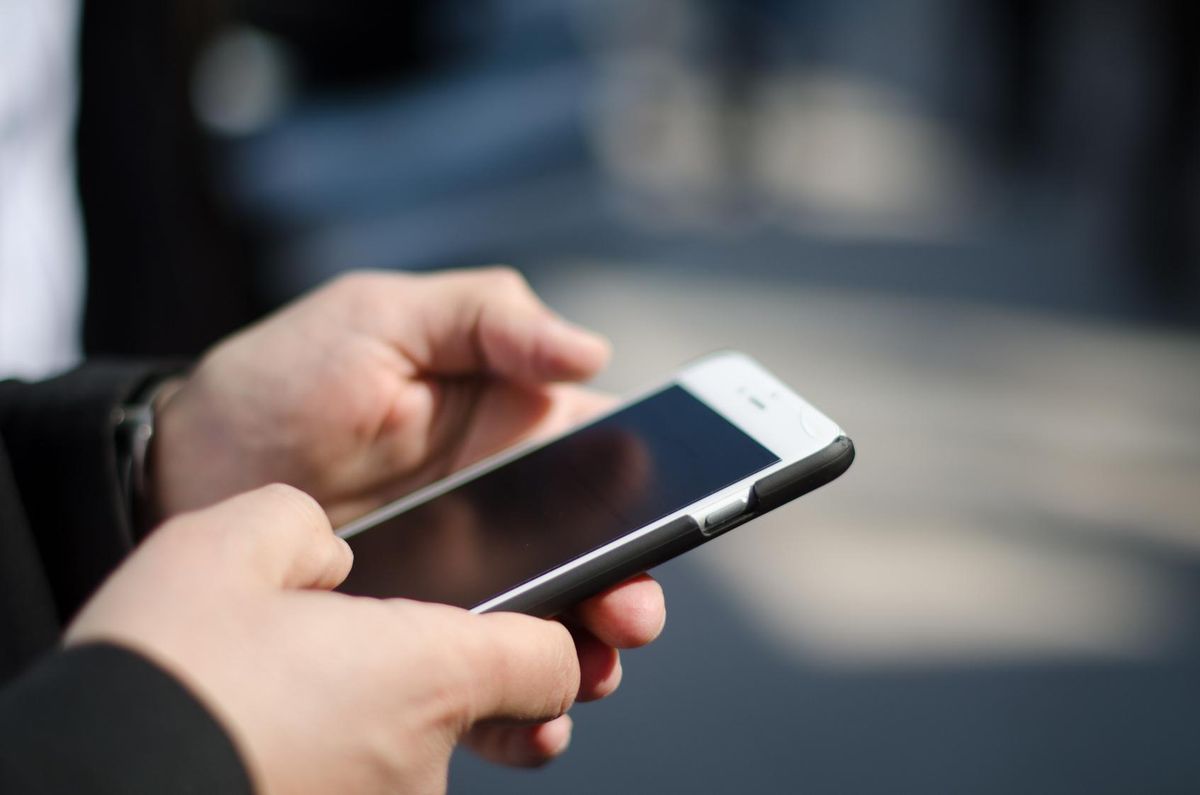 Close-up of hands using a smart phone