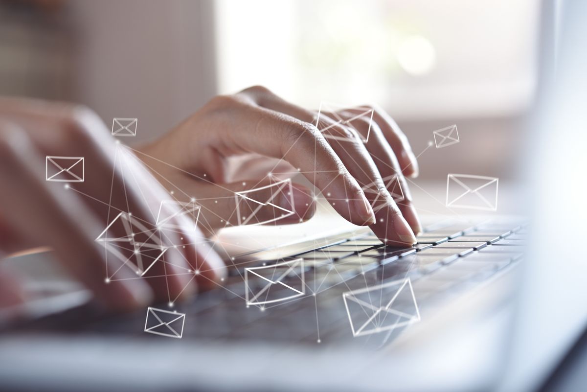 Close up of small business owner doing cold email outreach