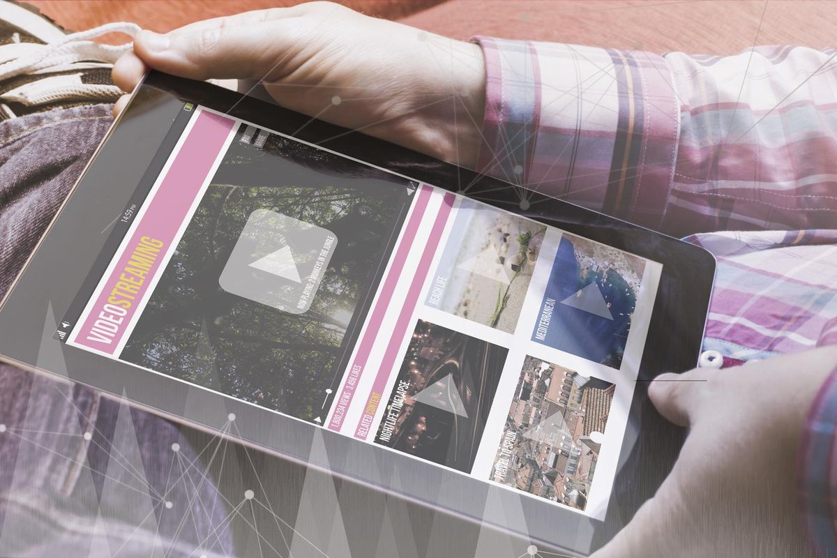 close-up view of man holding a tablet