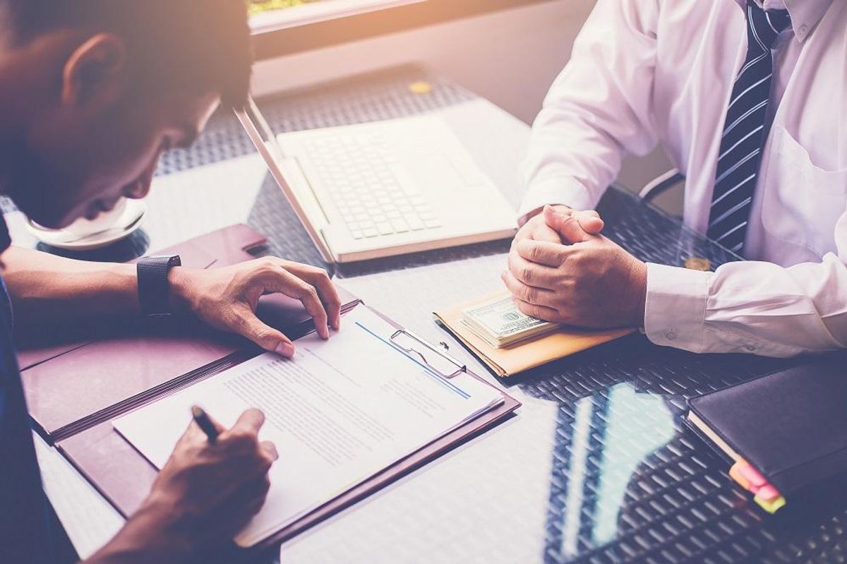 customer signing loan agreement