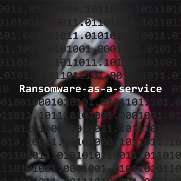 Cyber attack ransomware-as-a-service text in foreground screen
