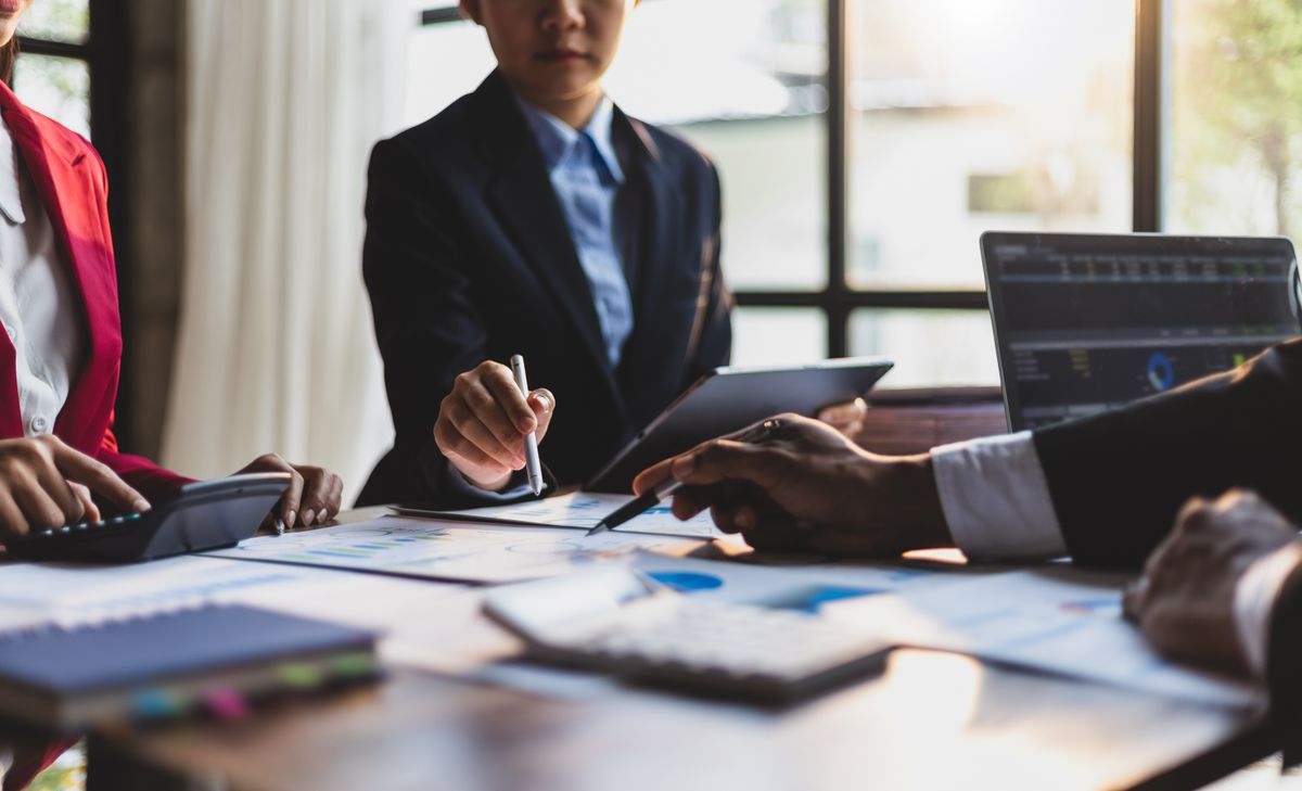 During a meeting, small business employees discuss 2025 trends in operations
