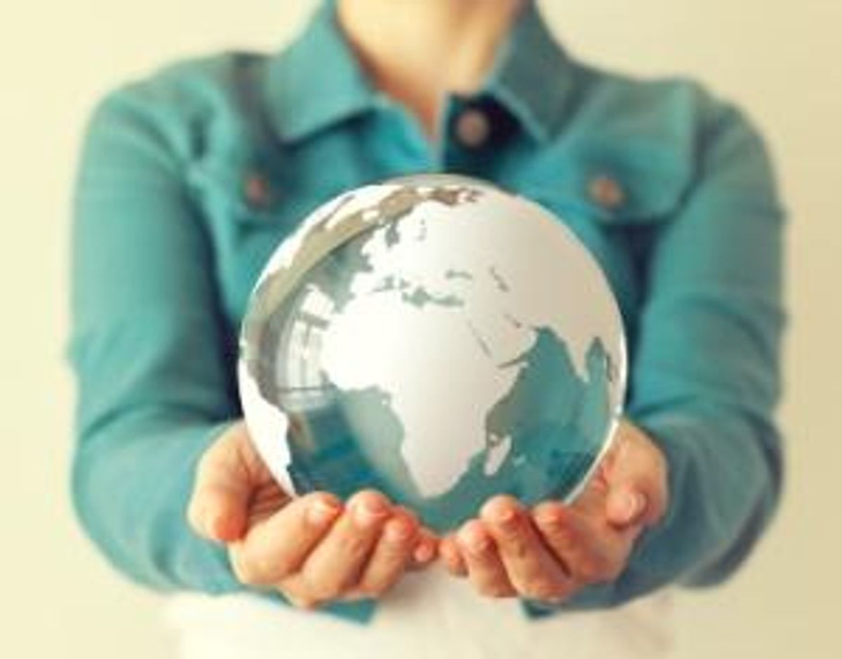 earth globe in hand