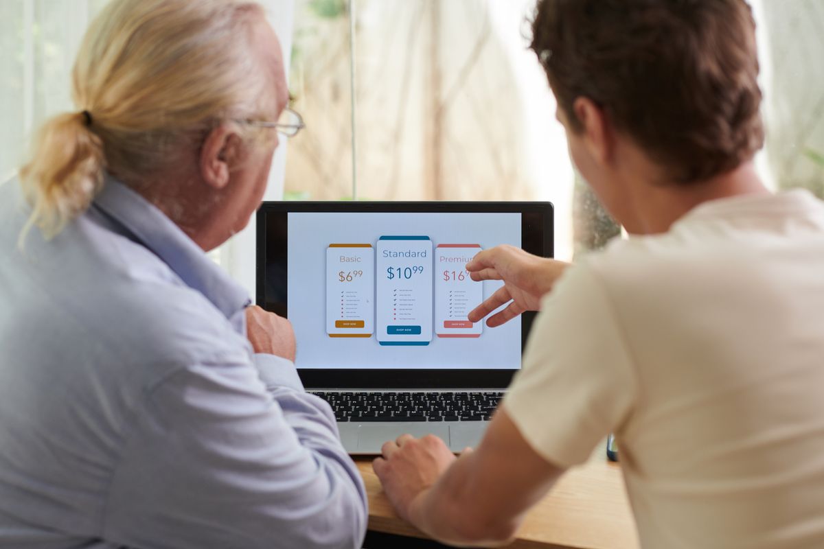 Employees at a subscription based business working on website