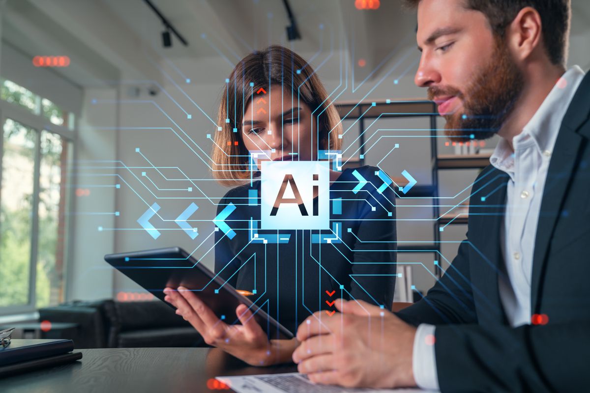 Employees of an SMB working together at office with AI