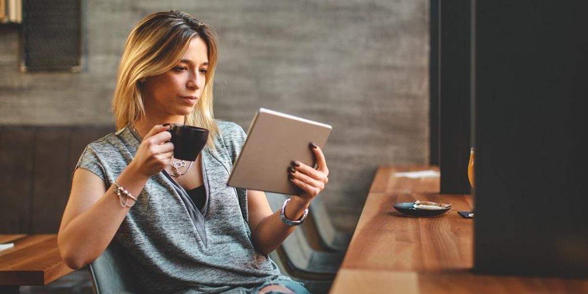 Entrepreneur reading a book about manifesting