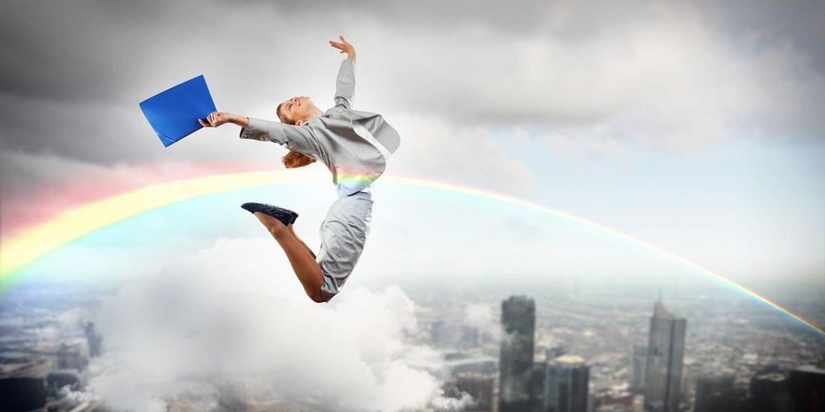 Excited businesswoman has rediscovered her spark through intuitive coaching