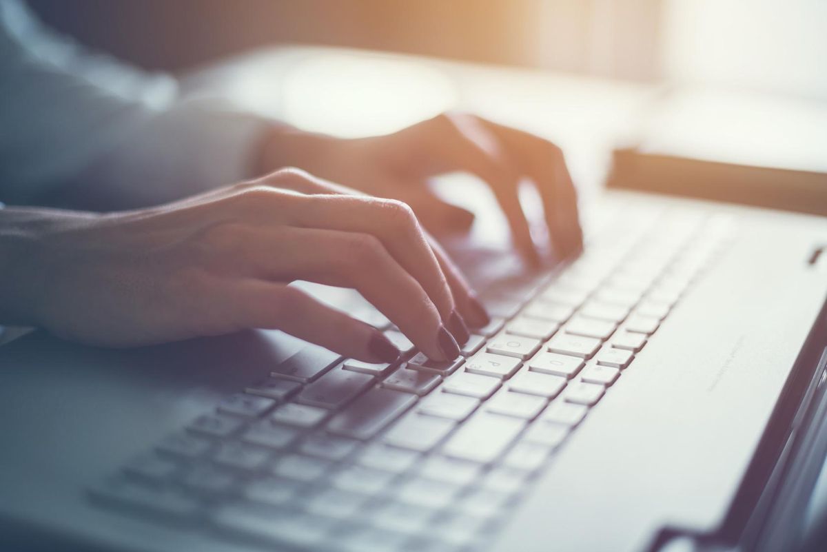 Female hands on the keyboard