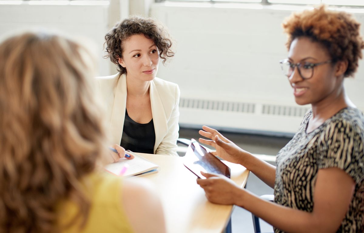 Female leader works with employees to build trust