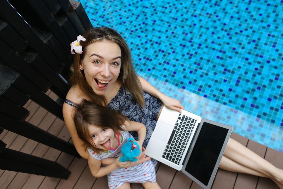 Female mother, daughter and laptop