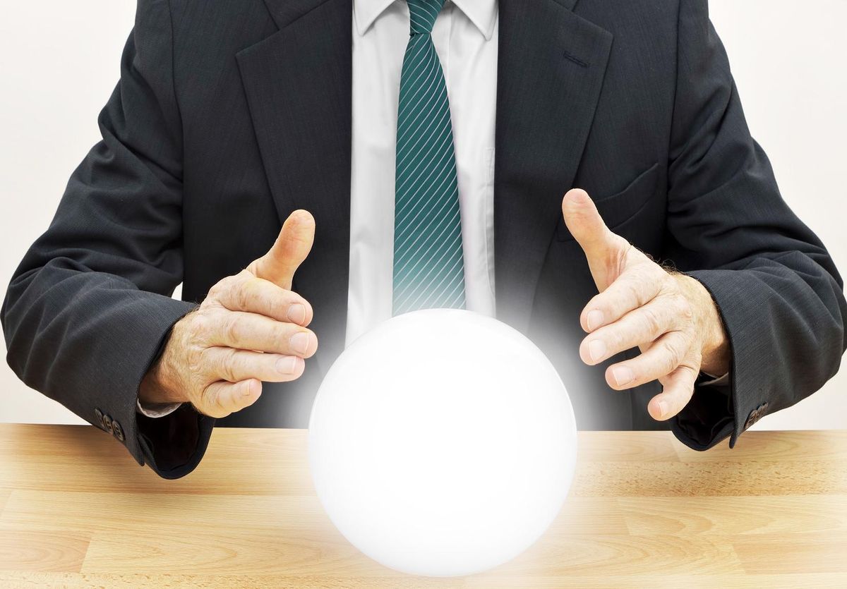 Fortune teller businessman with crystal ball