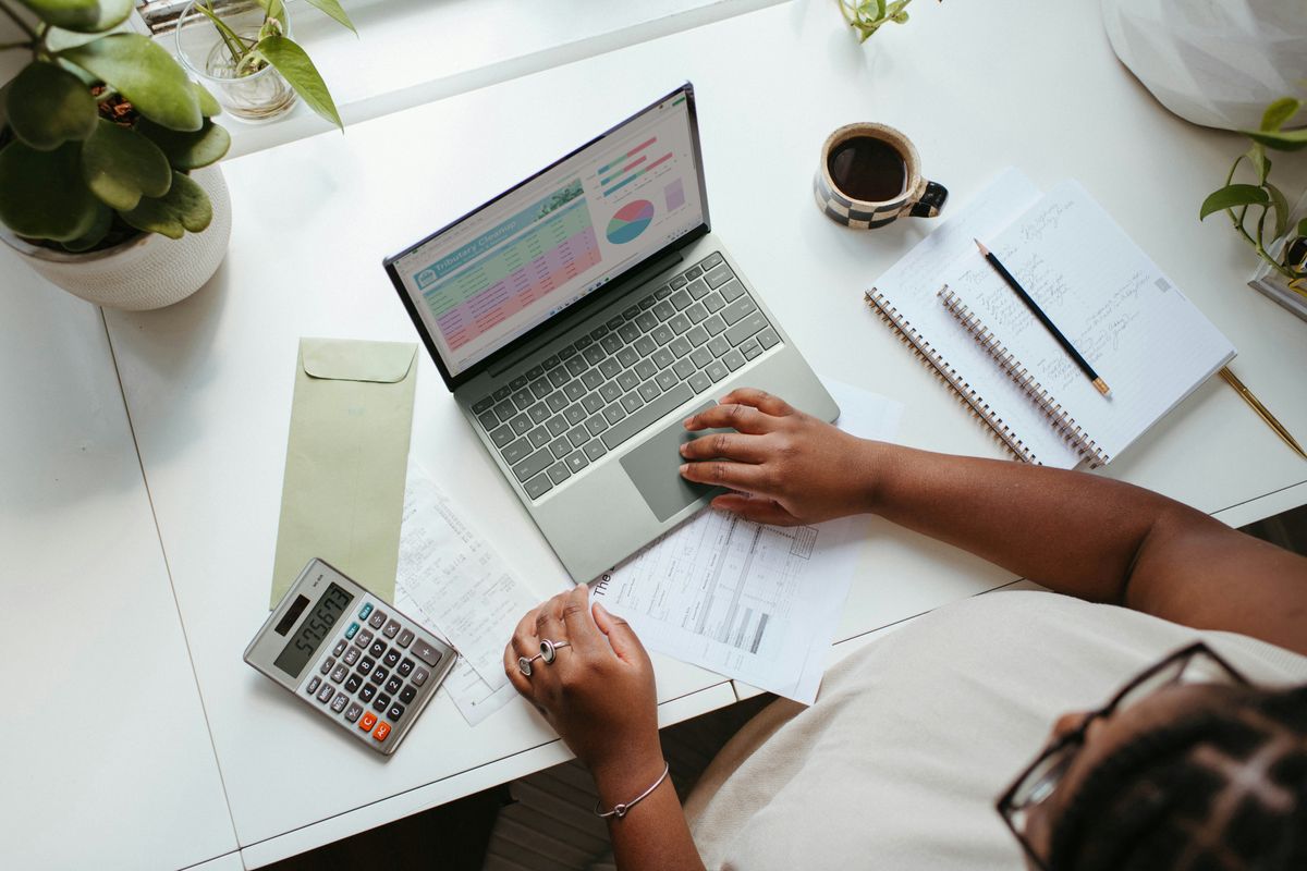 Freelancer building a financial budget on laptop