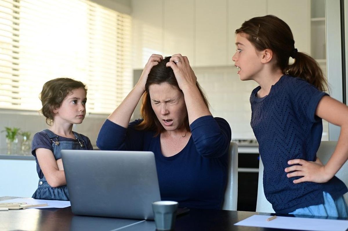 Frustrated mom working from home