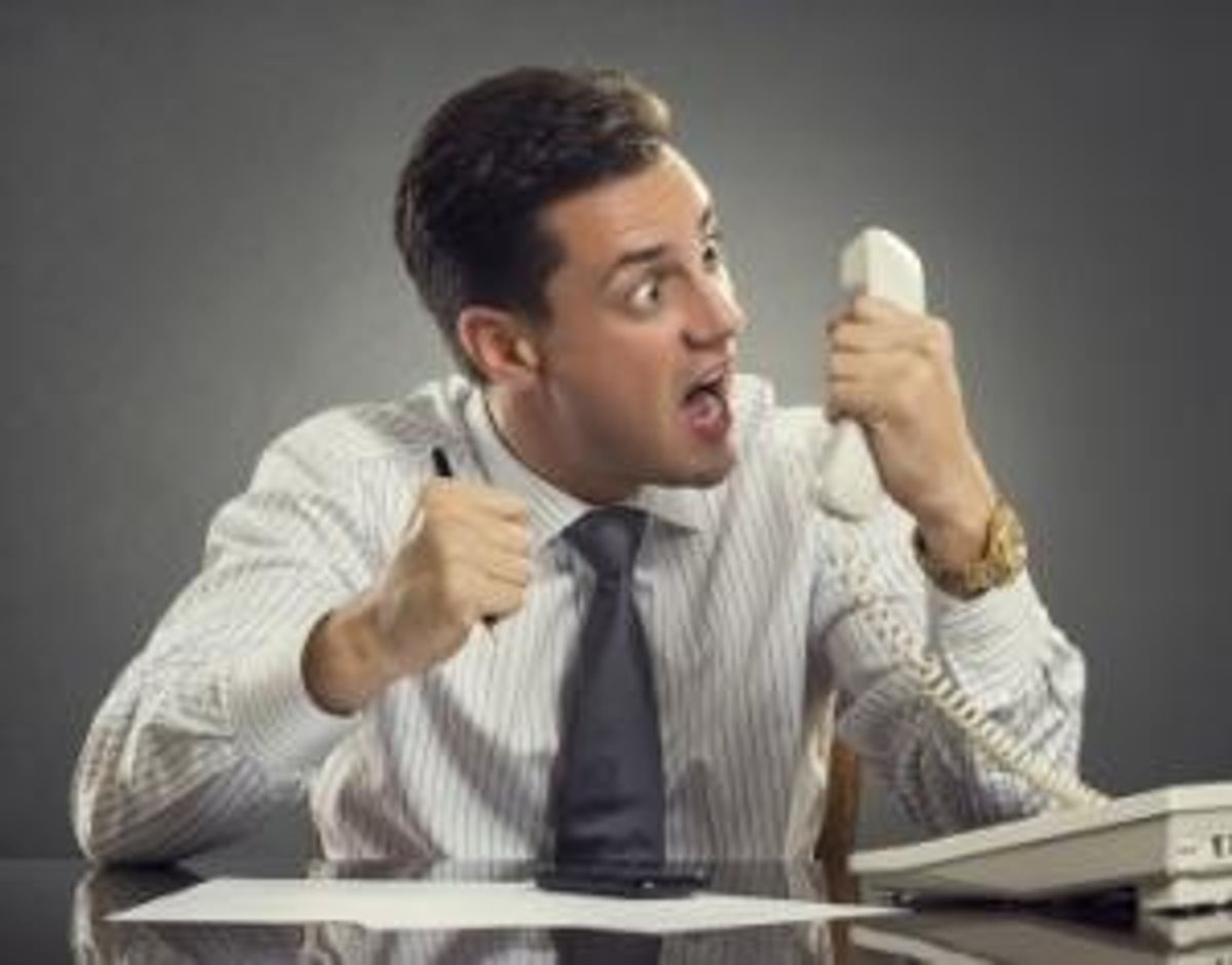 Furious businessman shouting on phone
