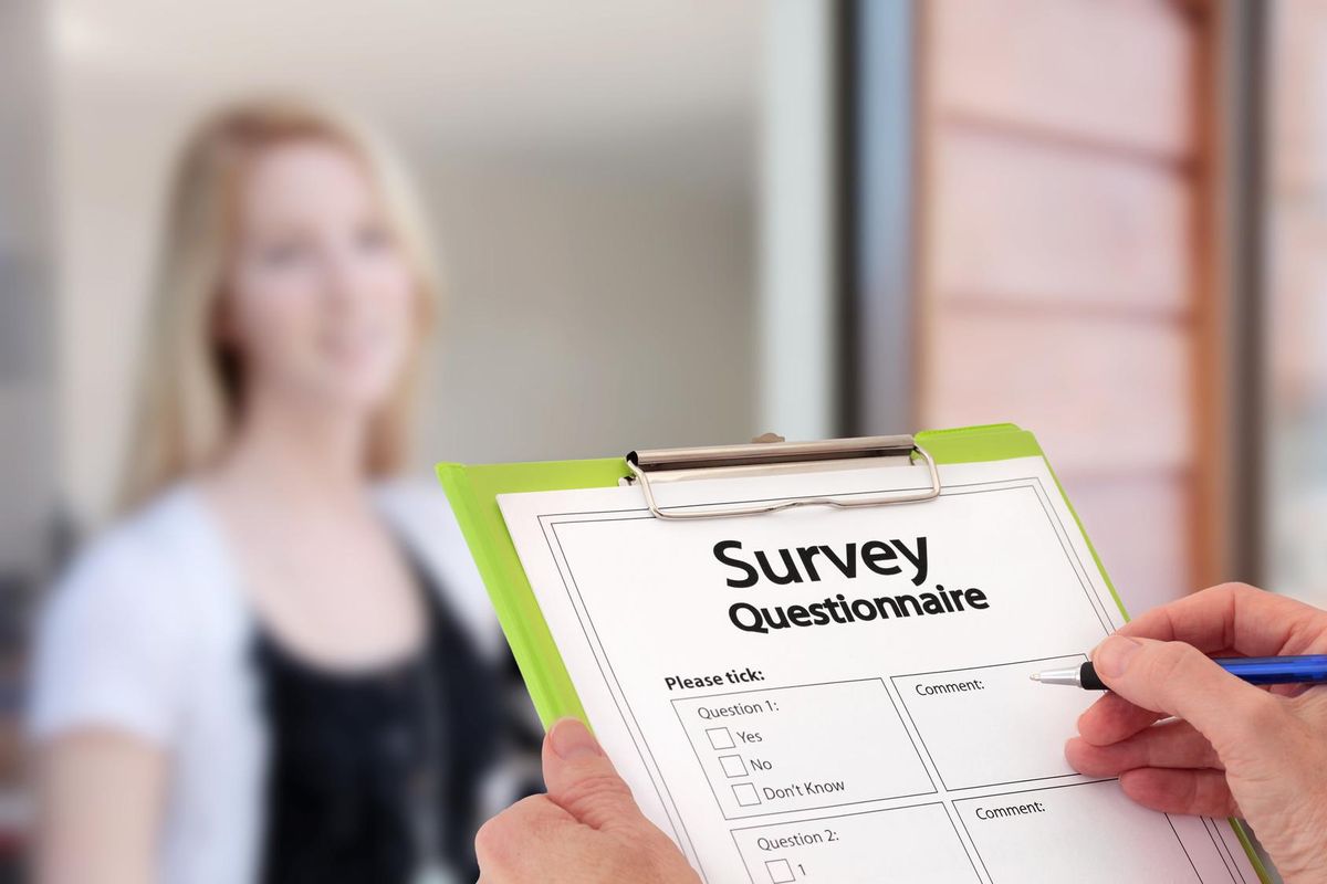 Girl Answering Market Research Survey Questionnaire at the Door