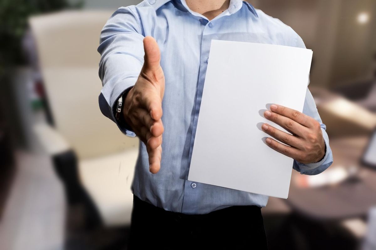 Greeting a visitor to the office with outstretched hand