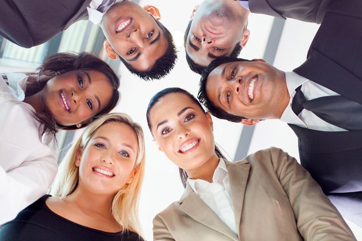 group of business people looking down