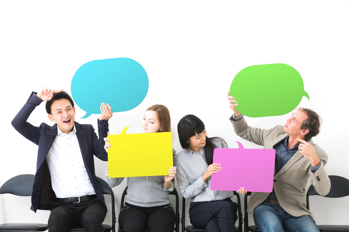 Group of people showing message boards.