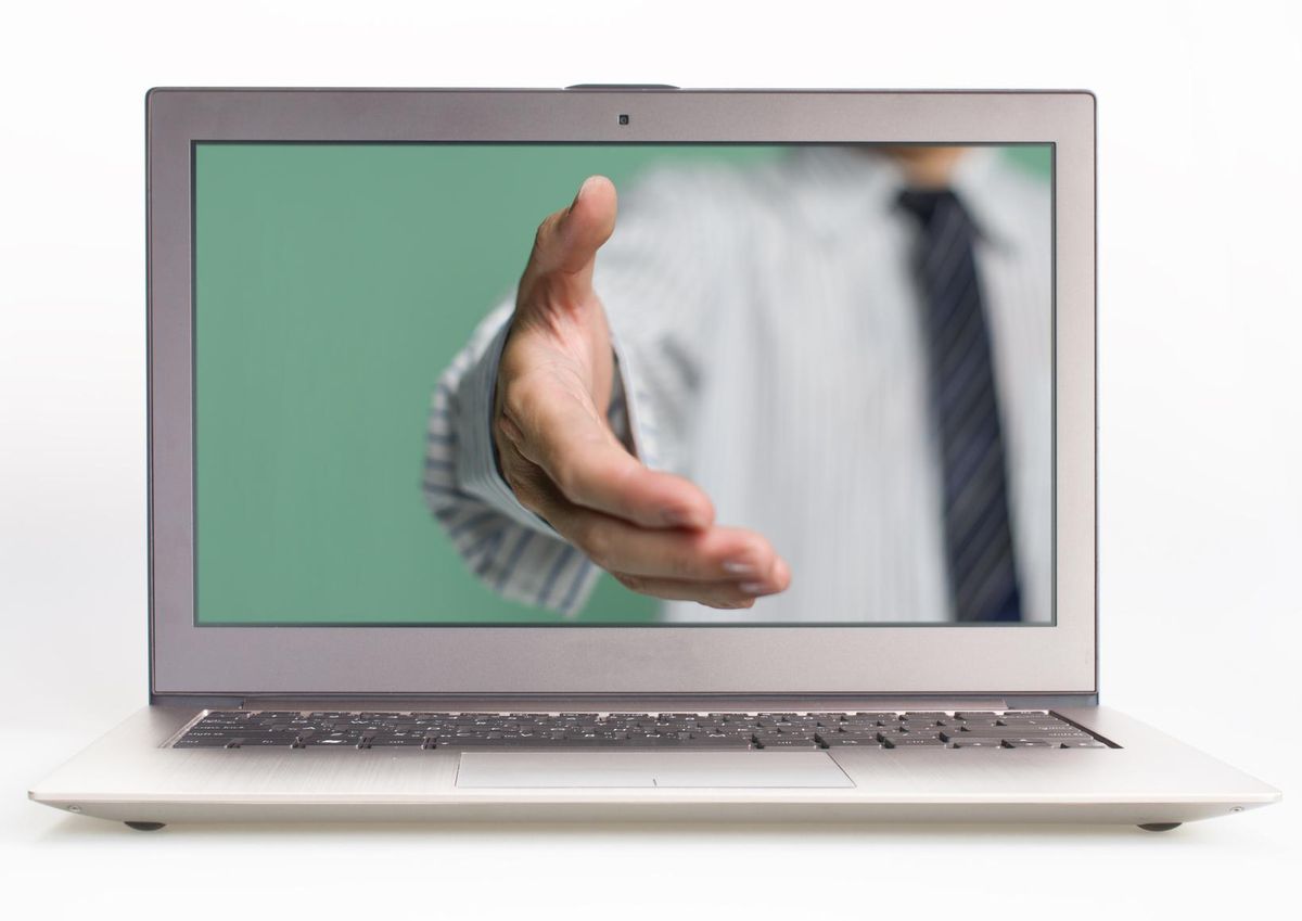 hand reaching out from screen