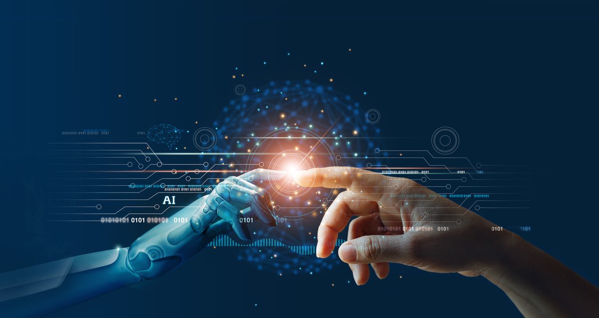 Hands of robot and human touching