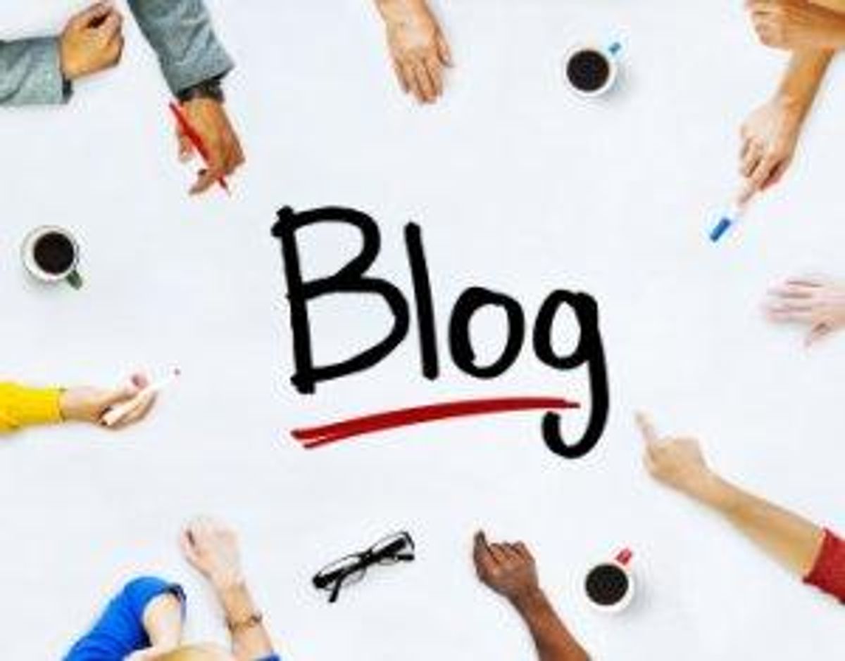 hands pointing toward word blog