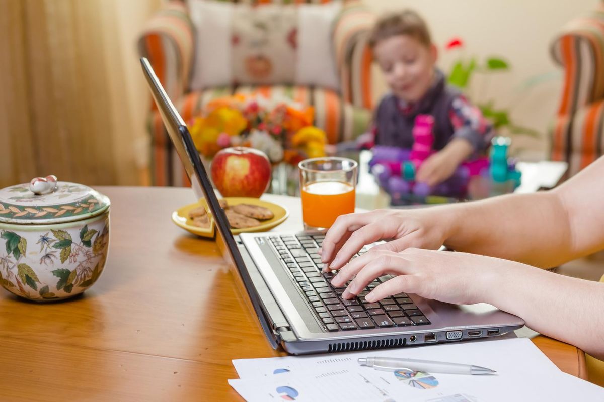 hands typing on laptop