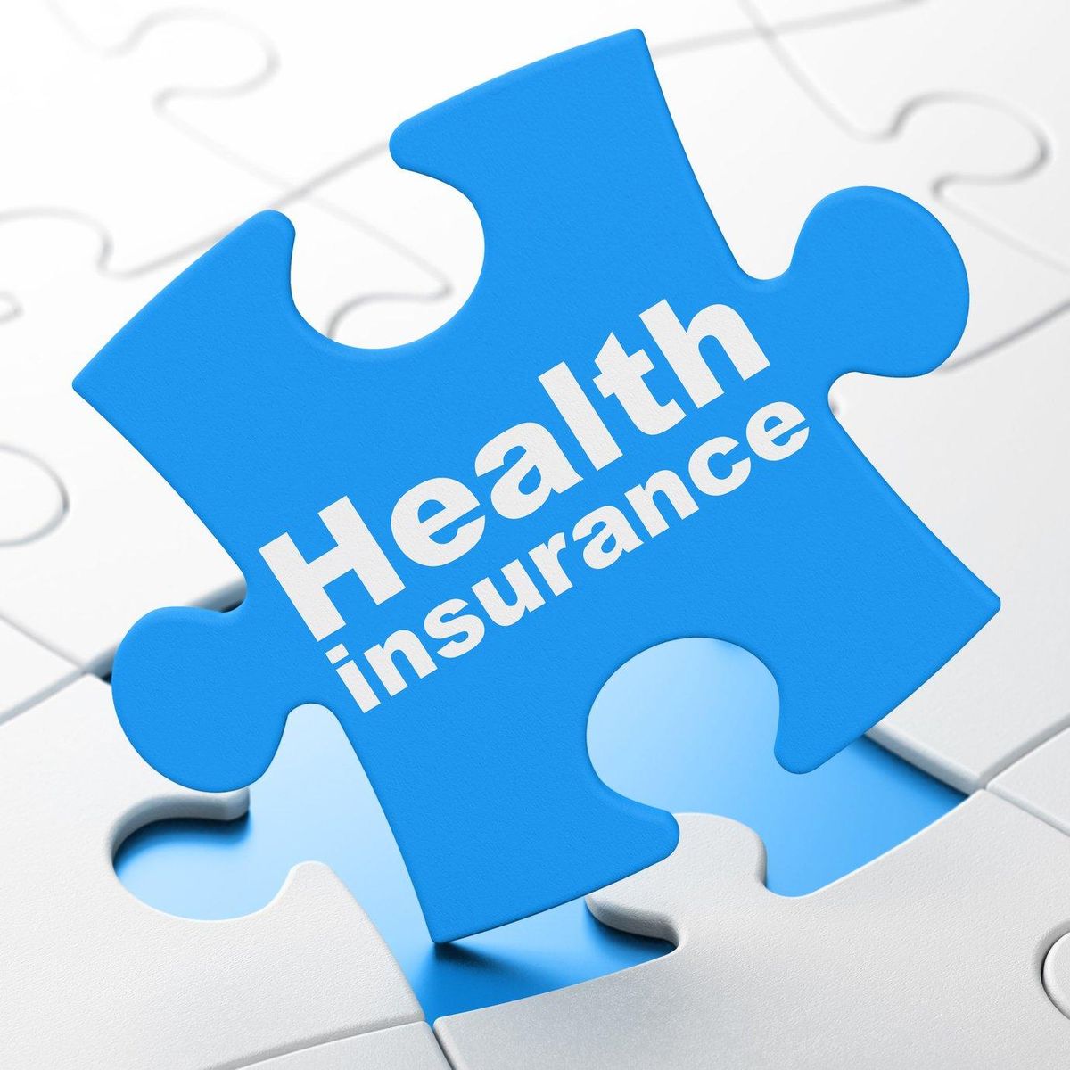Health Insurance on puzzle background