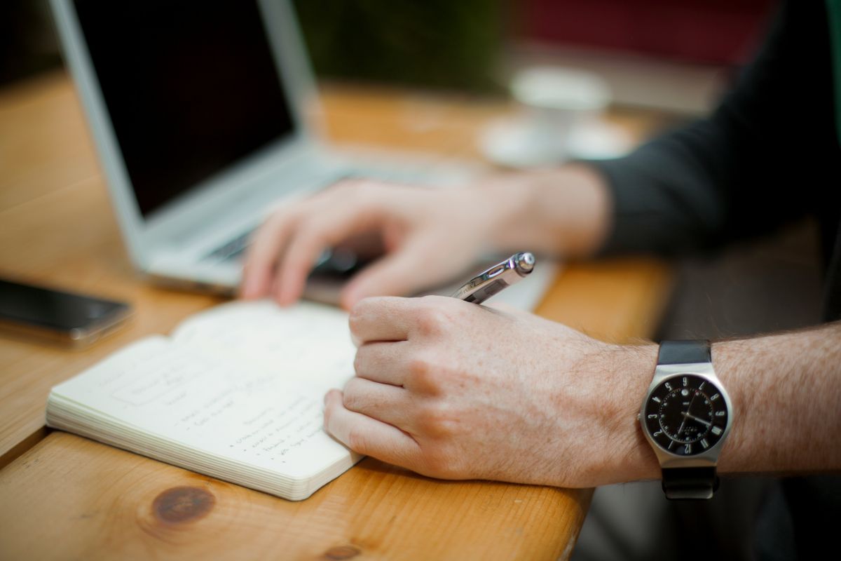 Highly successful person making a list and taking notes