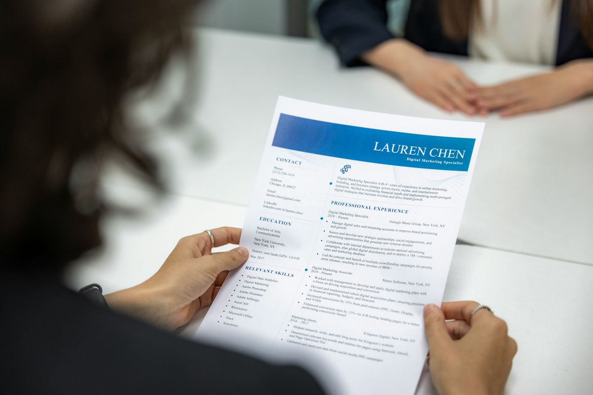 Hiring manager looking at a candidate's resume