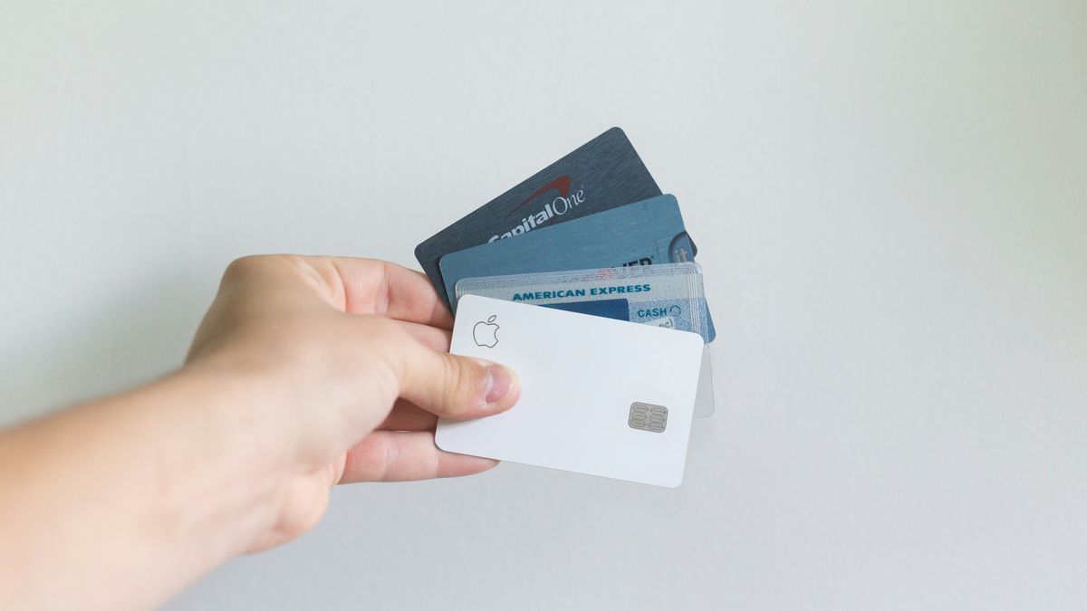 Holding a stack of credit cards