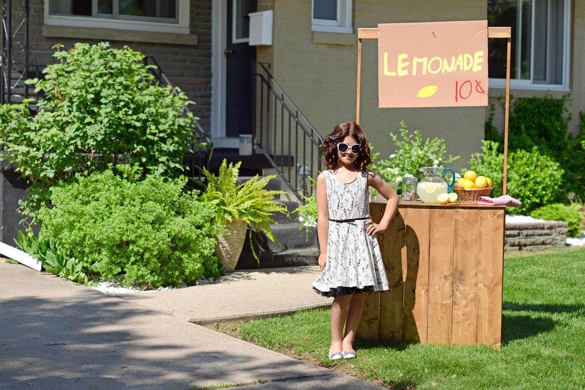little girl with lemonade stand