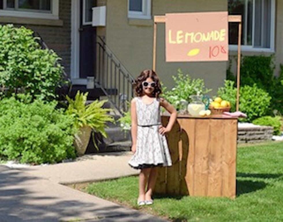 little girl with lemonade stand
