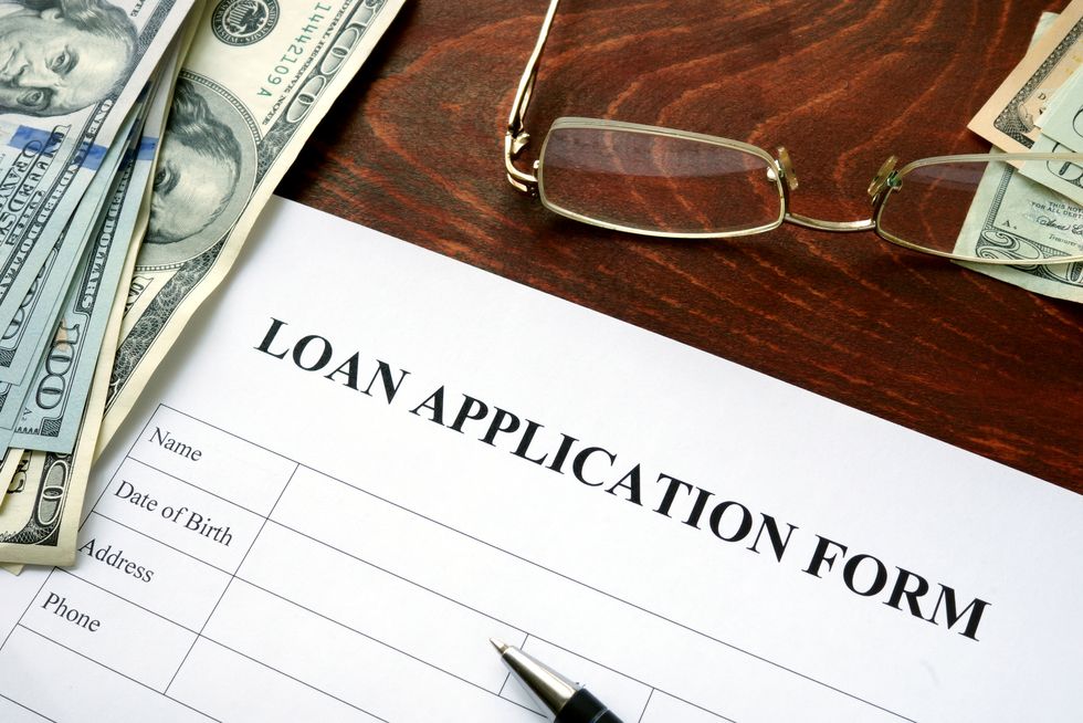 Loan application form on a wooden table.