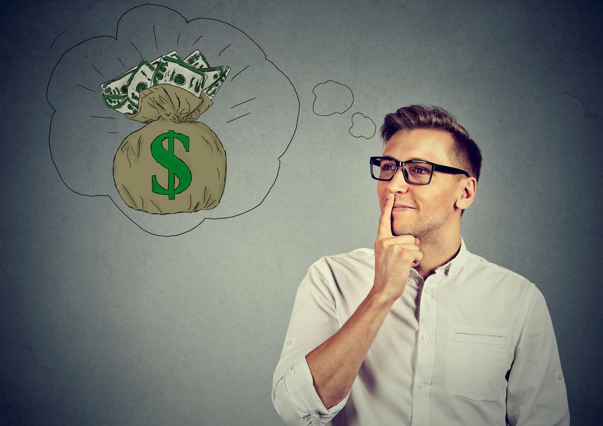 man dreaming of financial success