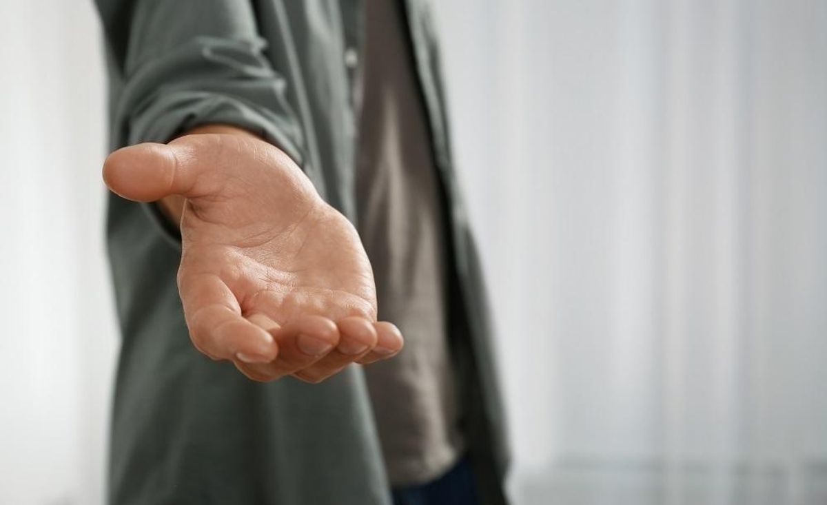 Man giving hand to somebody