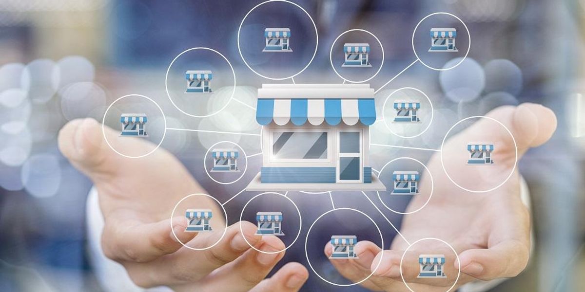 Man holding several insurance franchises