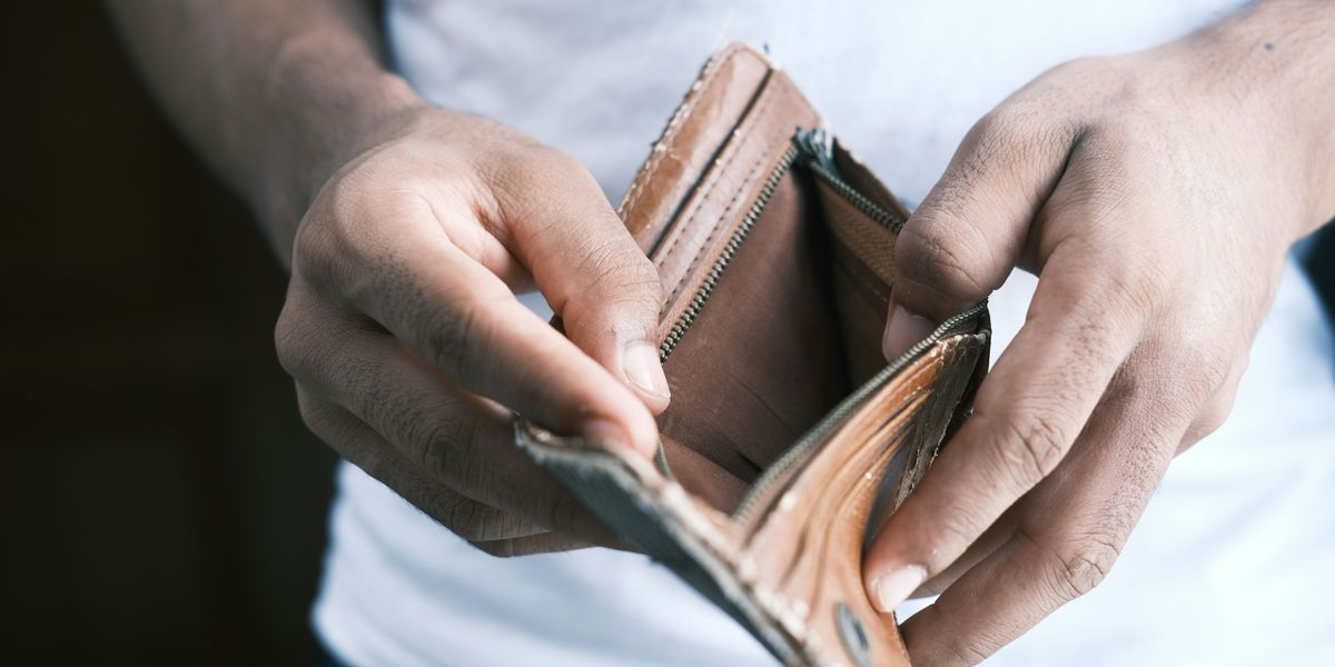 Man opening his empty wallet