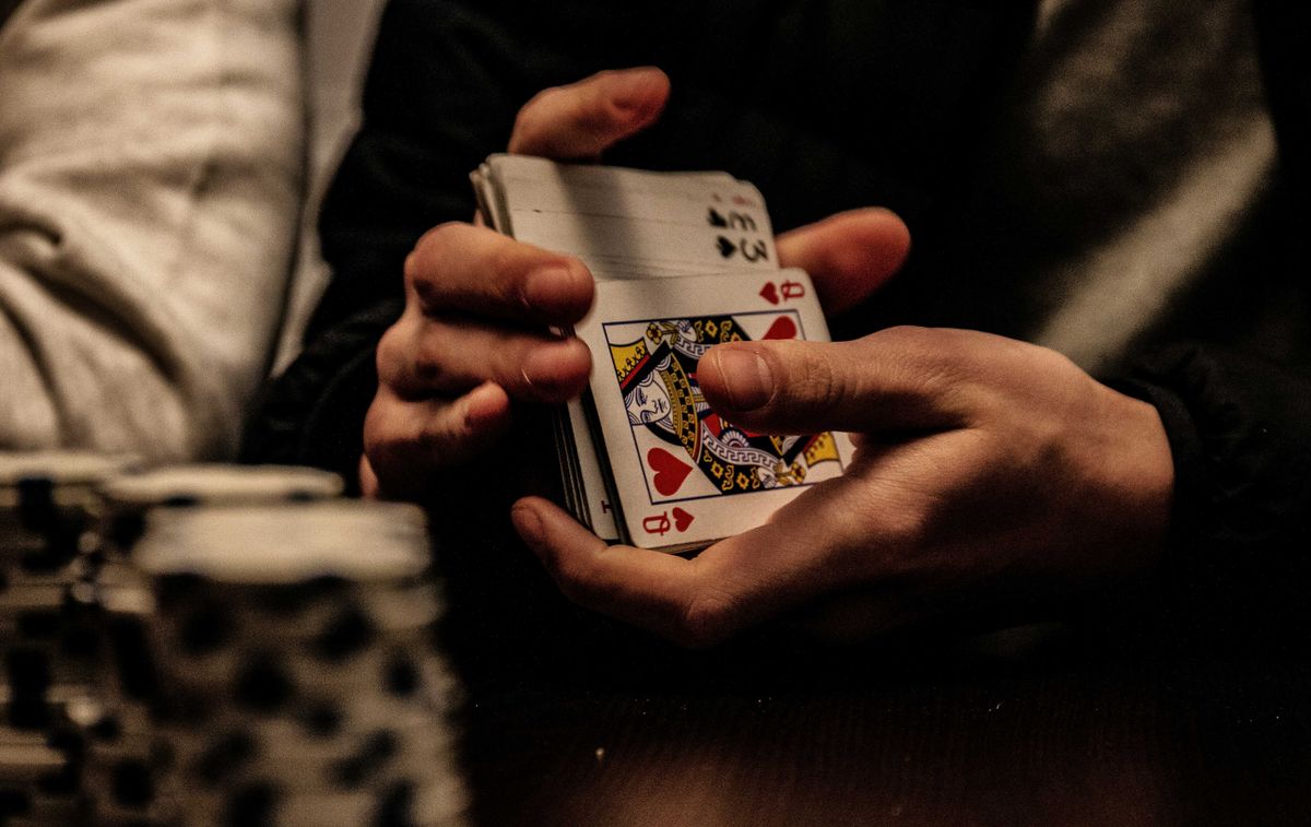 Man shuffling cards at the World Series of Poker