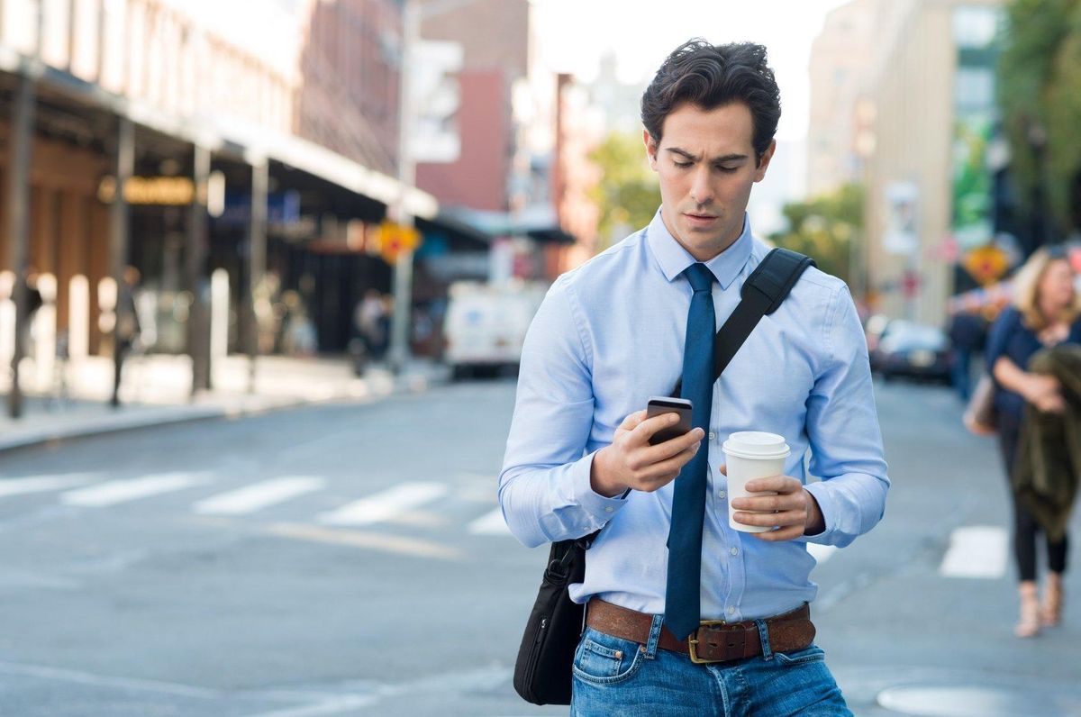 Man using mobile app for a small business